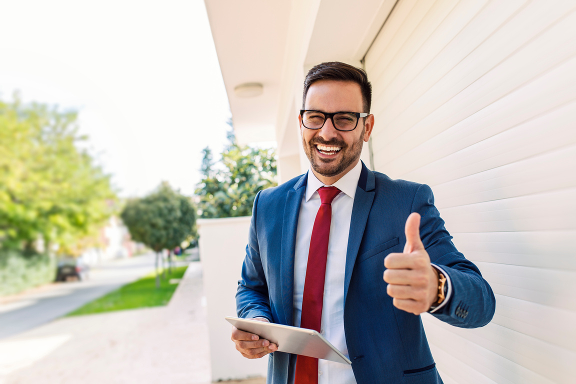 Happy Businessman Giving Thumbs Up